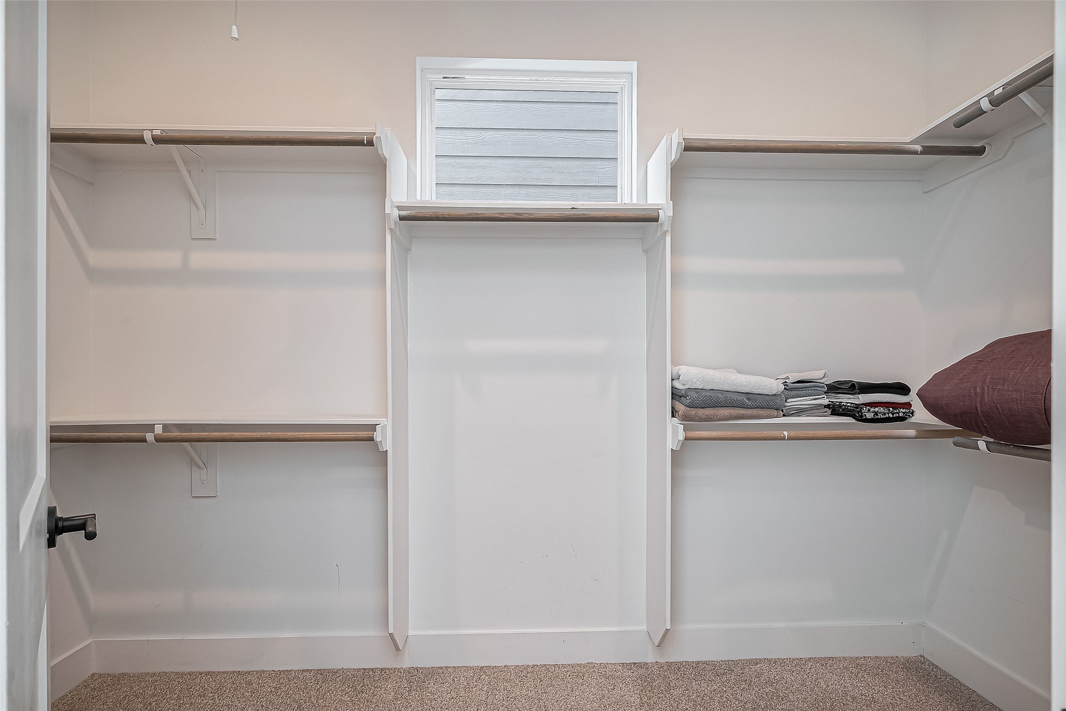 2518 Terry Street Houston, TX 77009 - Photo 16 of 17 Generous primary closet with functional layout, carpet flooring, and abundant space for wardrobe storage.
