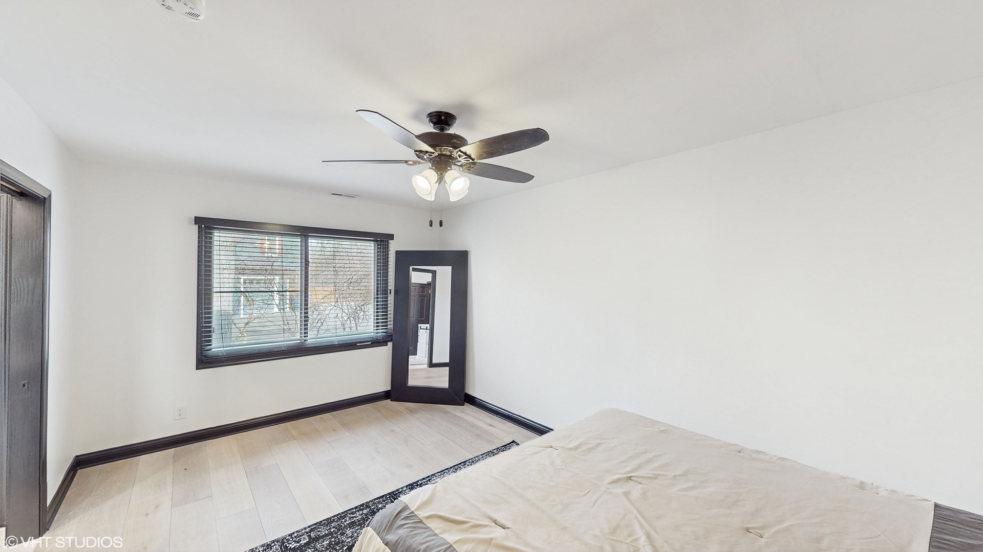 15160 West Oak Spring Road Libertyville, IL 60048 - Photo 20 of 36 a view of a big room with windows and chandelier fan