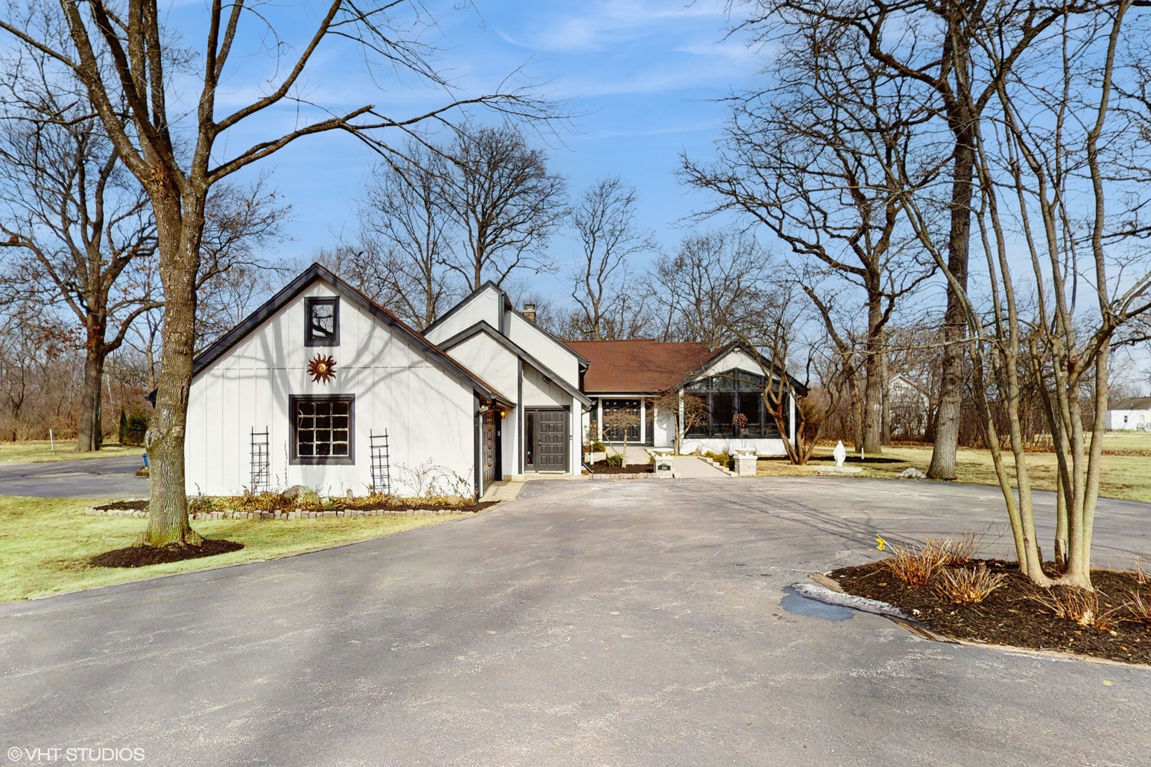 15160 West Oak Spring Road Libertyville, IL 60048 - Photo 2 of 36 a front view of a house with a yard and garage