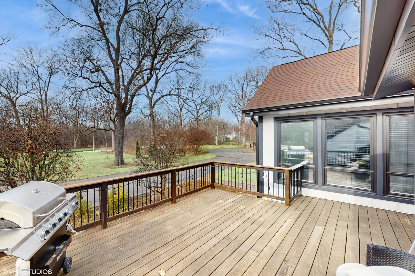15160 West Oak Spring Road Libertyville, IL 60048 - Photo 36 of 36 a view of a wooden deck with a yard