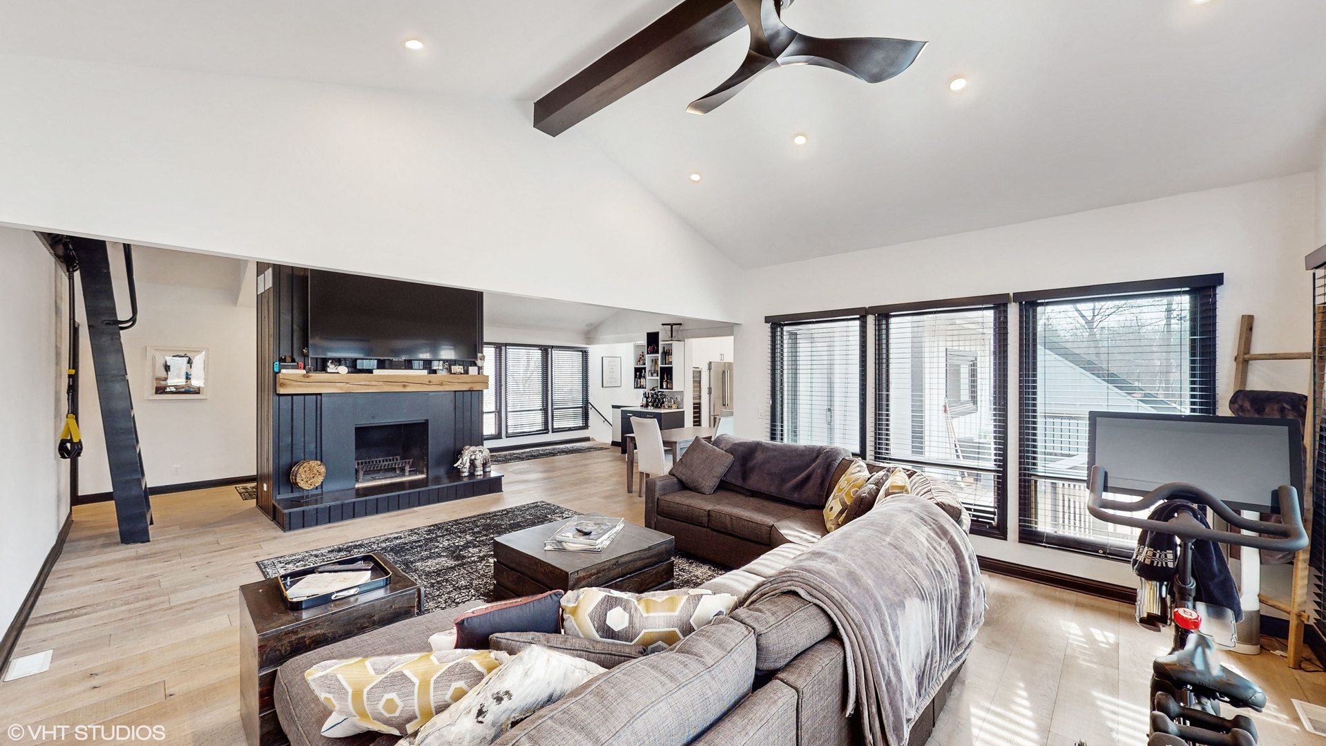 15160 West Oak Spring Road Libertyville, IL 60048 - Photo 5 of 36 a living room with furniture a flat screen tv and a fireplace