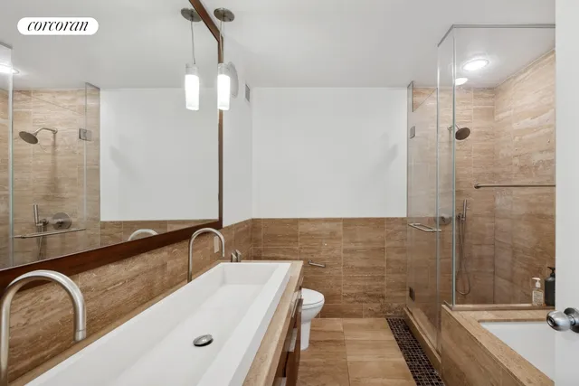 a view of a workspace with furniture and wooden floor