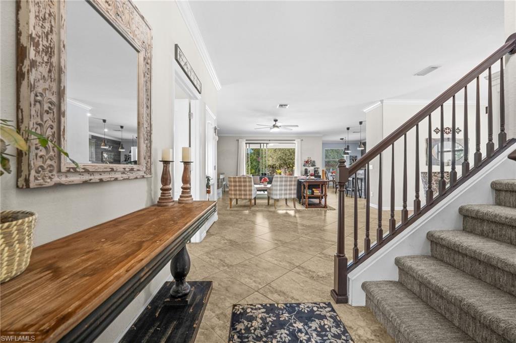 4754 Abaca Circle Naples, FL 34119 - Photo 2 of 46 a view of a living room and workspace