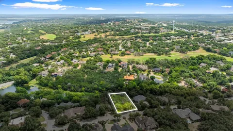 a view of a city with lush green forest