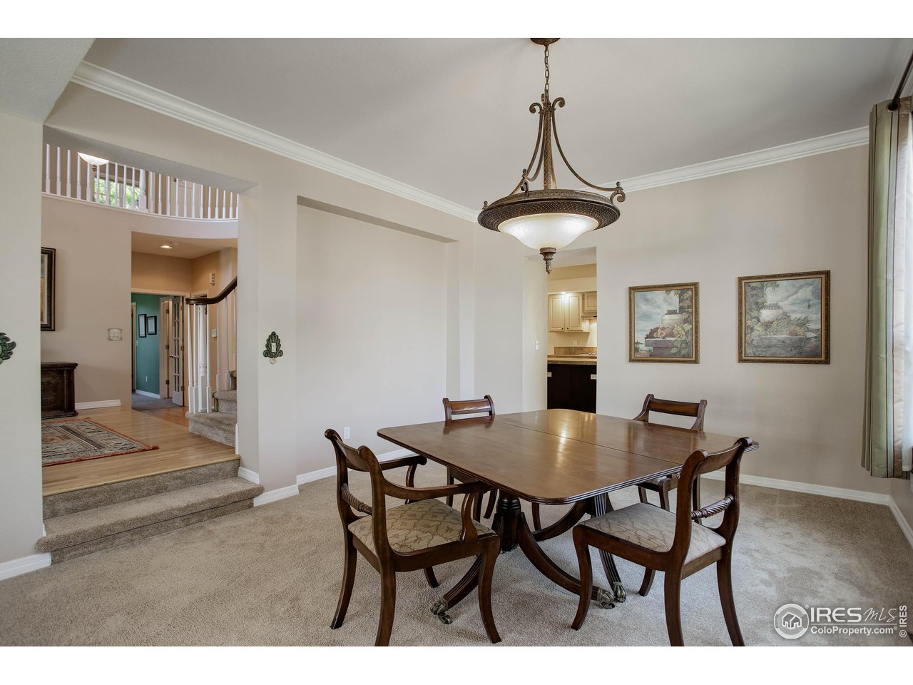 7346 Augusta Drive Boulder, CO 80301 - Photo 12 of 40 a view of a dining room with furniture and wooden floor