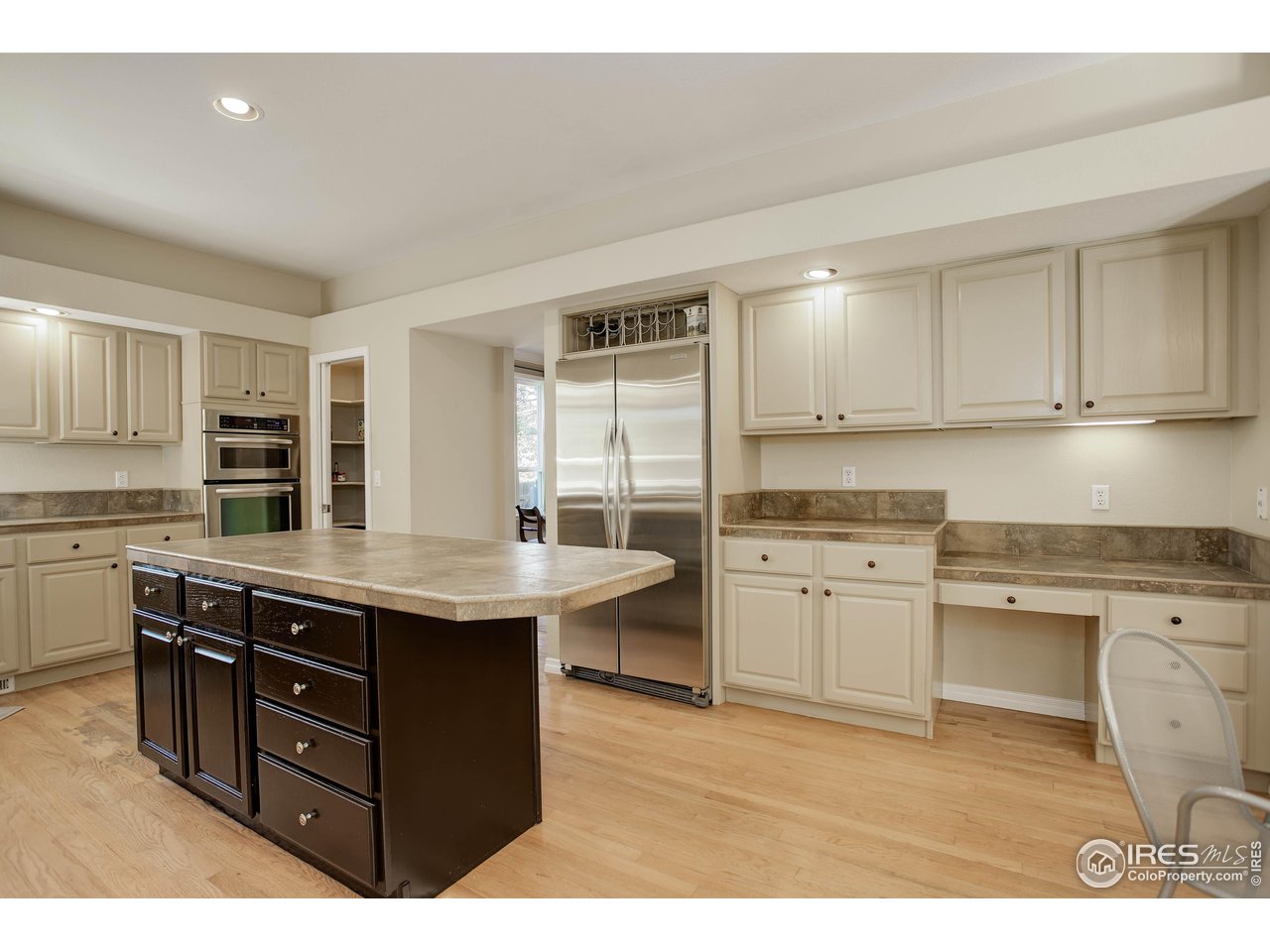 7346 Augusta Drive Boulder, CO 80301 - Photo 14 of 40 a kitchen with a stove a sink and a refrigerator