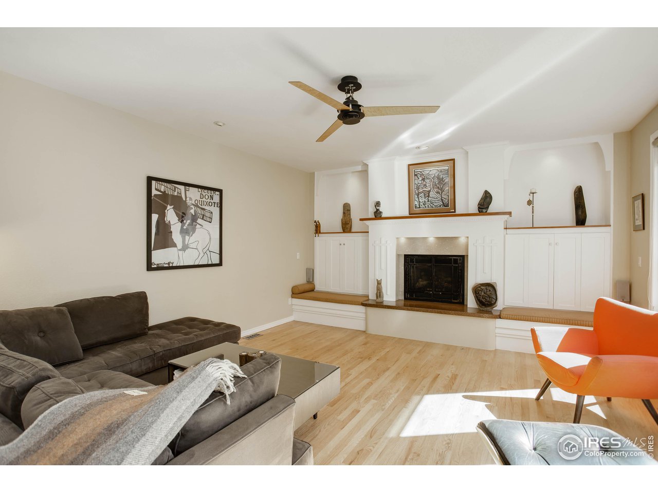7346 Augusta Drive Boulder, CO 80301 - Photo 17 of 40 a living room with furniture a fireplace and a flat screen tv