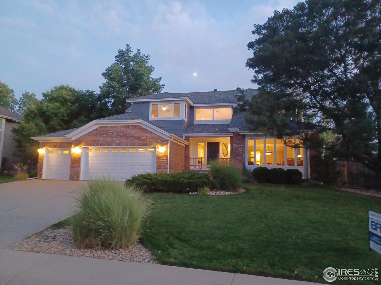 7346 Augusta Drive Boulder, CO 80301 - Photo 2 of 40 a front view of a house with a yard and garage