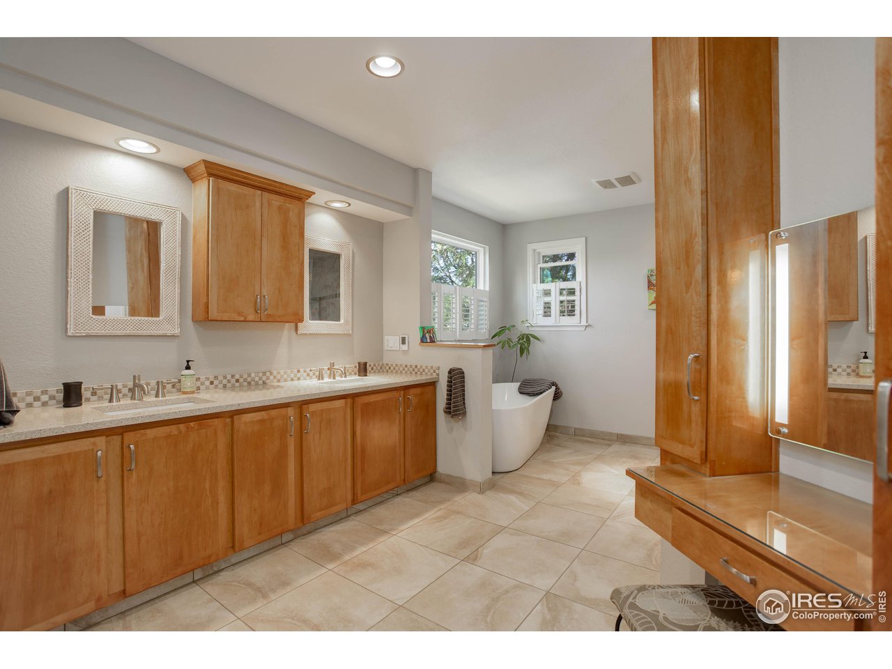 7346 Augusta Drive Boulder, CO 80301 - Photo 21 of 40 a spacious bathroom with a tub sink and mirror