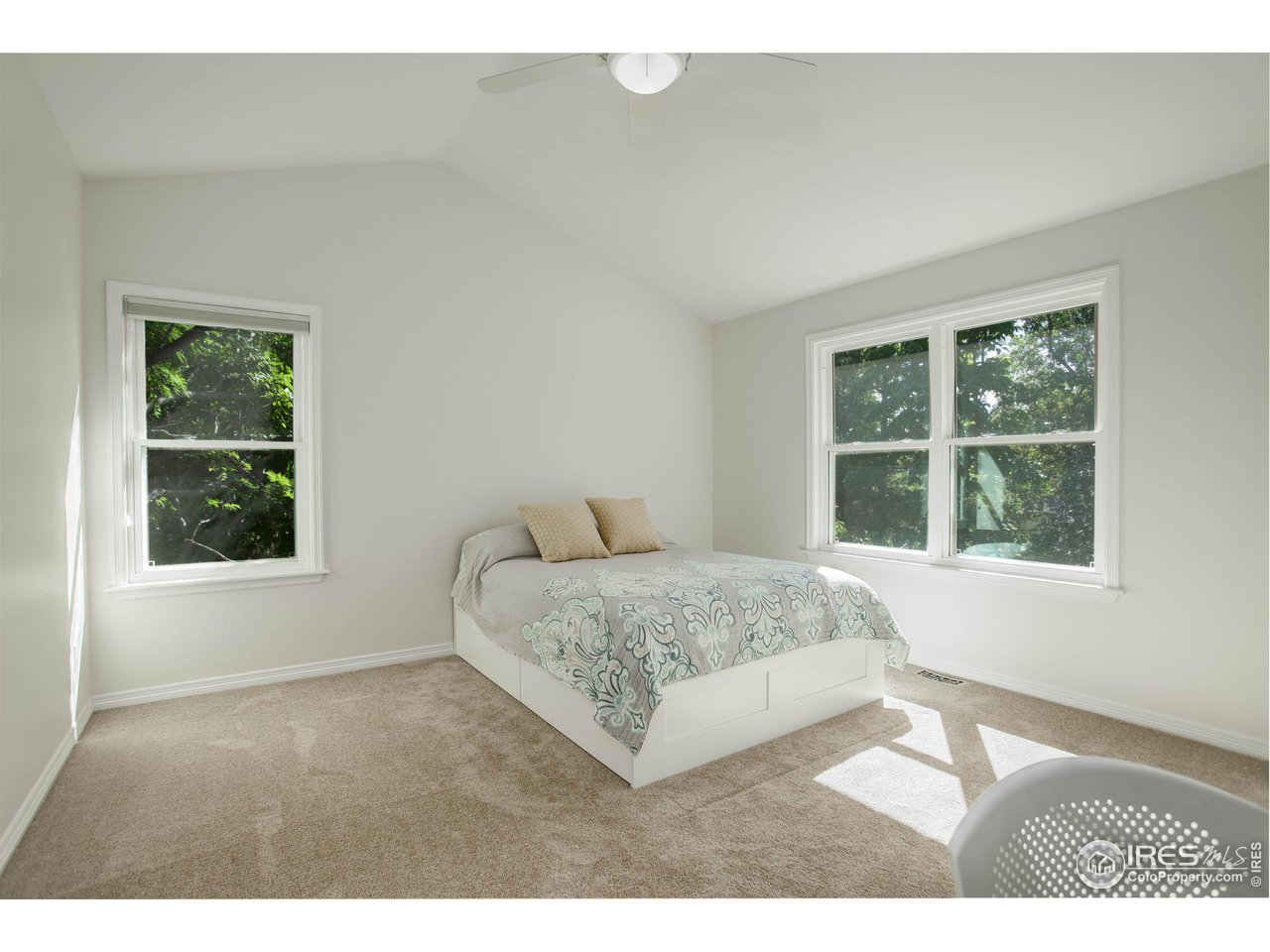 7346 Augusta Drive Boulder, CO 80301 - Photo 25 of 40 a living room with a bed furniture and next to a window