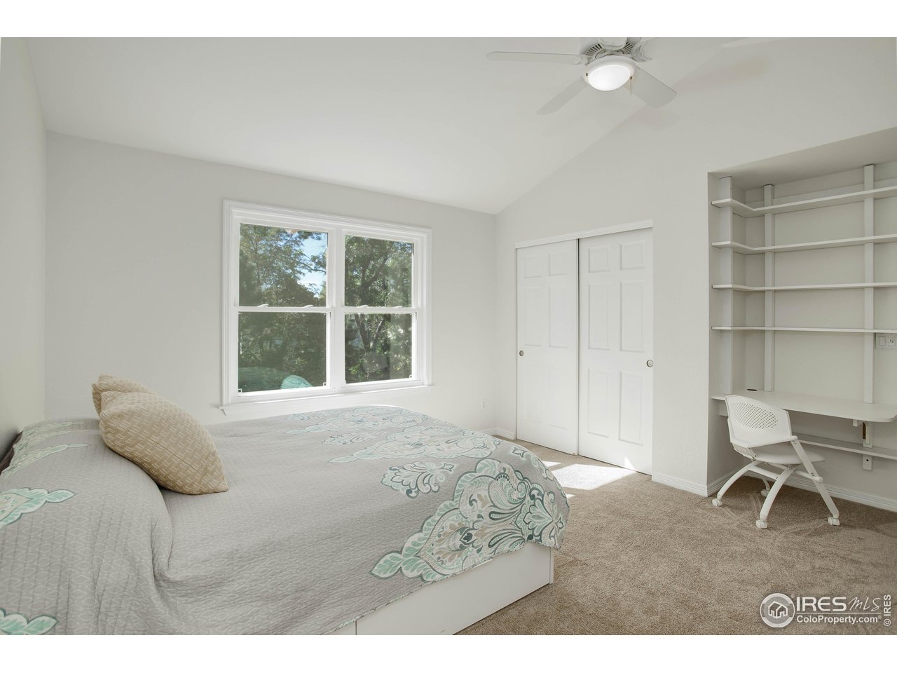 7346 Augusta Drive Boulder, CO 80301 - Photo 26 of 40 a bedroom with a bed and a window