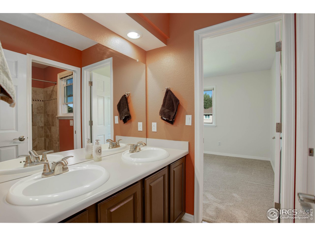 7346 Augusta Drive Boulder, CO 80301 - Photo 28 of 40 a bathroom with a sink and a mirror