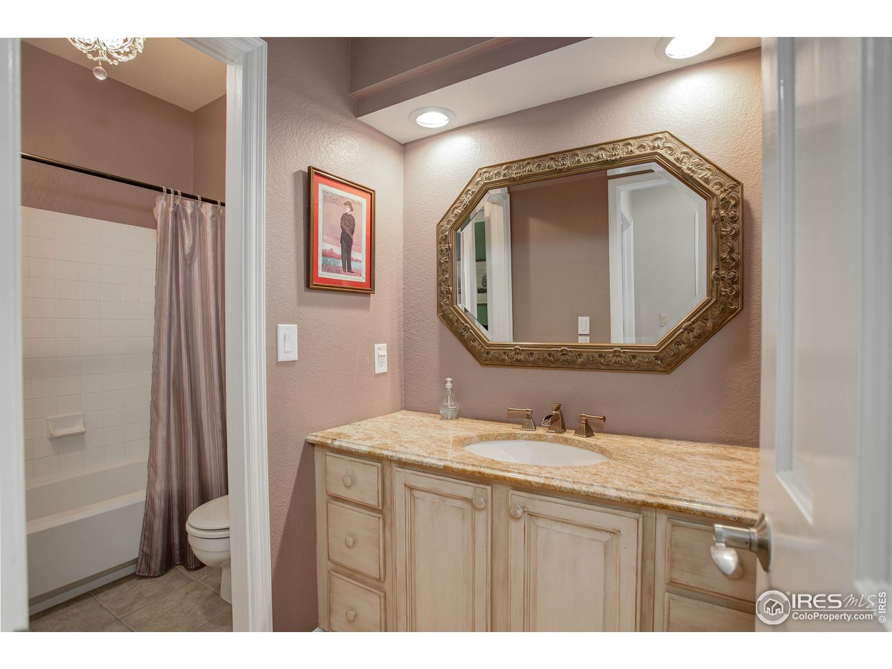 7346 Augusta Drive Boulder, CO 80301 - Photo 31 of 40 a bathroom with a sink vanity and a mirror