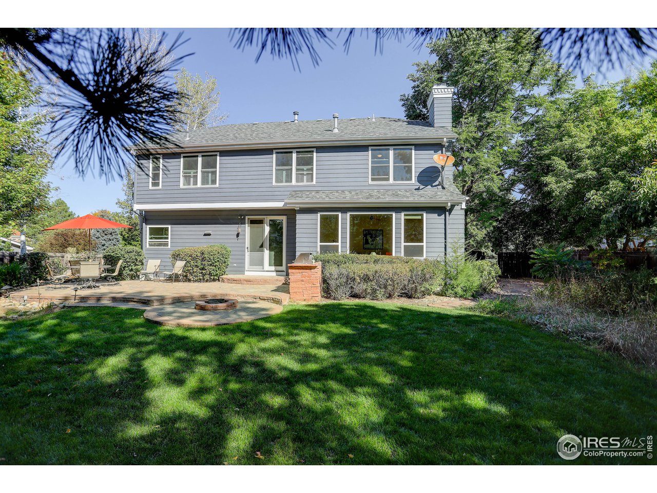 7346 Augusta Drive Boulder, CO 80301 - Photo 4 of 40 a front view of a house with a garden
