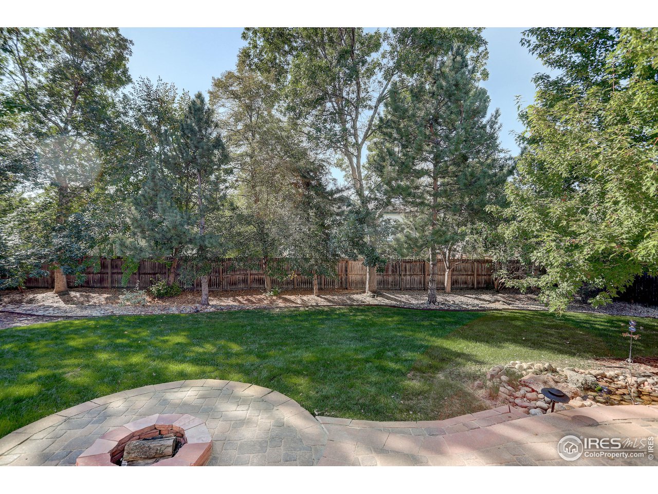 7346 Augusta Drive Boulder, CO 80301 - Photo 5 of 40 a view of a backyard with a garden and plants