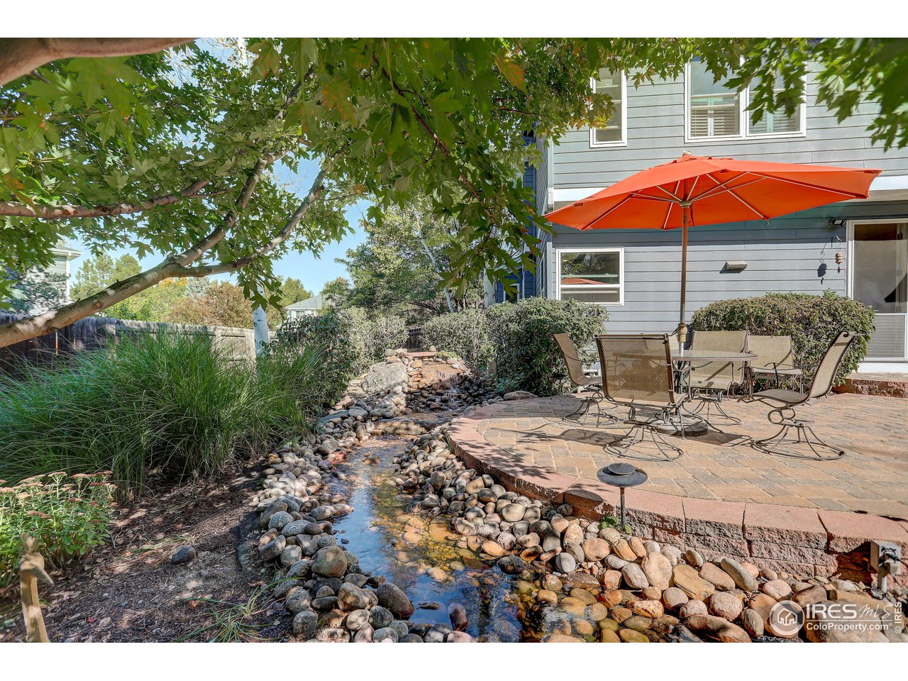7346 Augusta Drive Boulder, CO 80301 - Photo 6 of 40 a view of swimming pool with lawn chairs under an umbrella