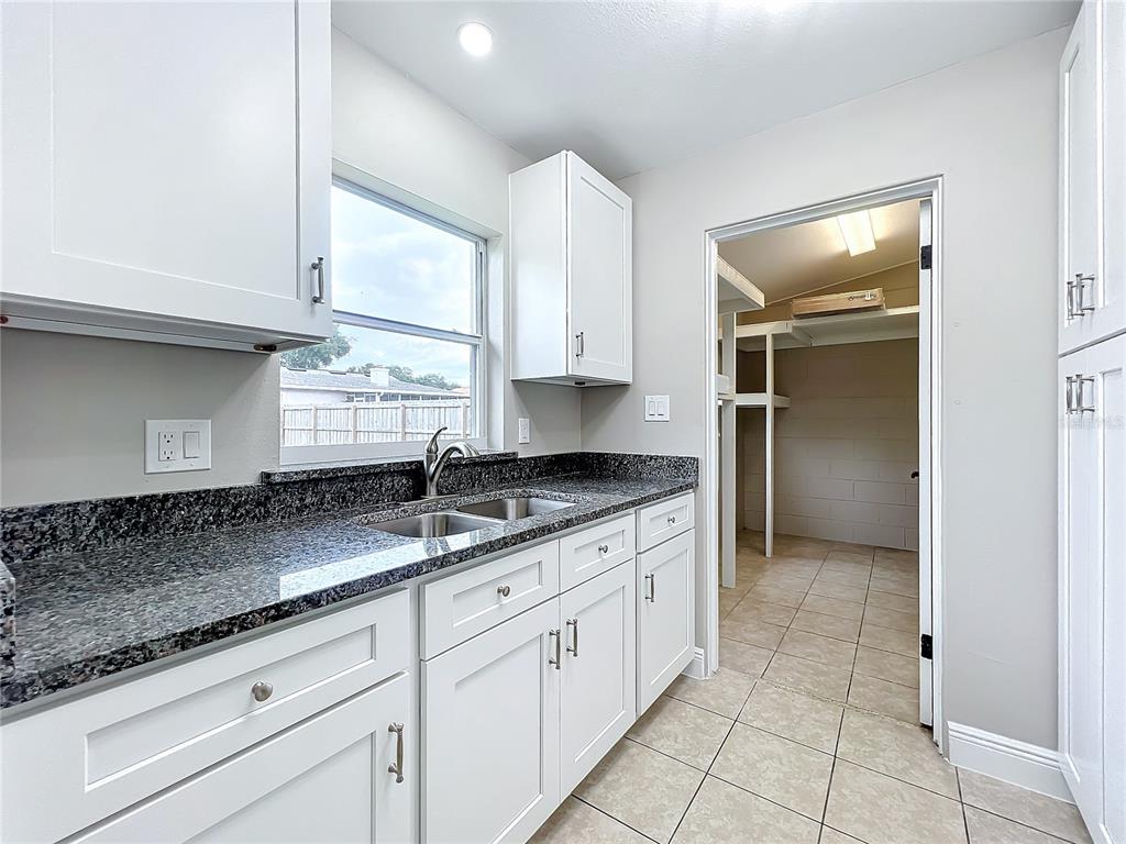 600 Ridgefield Avenue Ocoee, FL 34761 - Photo 24 of 45 Stainless steel appliances in your newly renovated kitchen with new cabinets and solid granite countertops.
