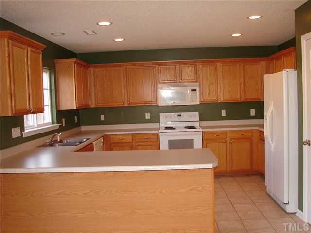 117 Depot Ridge Road Garner, NC 27529 - Photo 3 of 21 Large kitchen open to the dining area for easy entertaining.