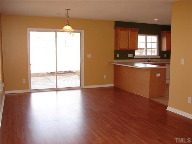117 Depot Ridge Road Garner, NC 27529 - Photo 8 of 21 View from the Family room to the Dining/kitchen area. Sliding glass door opens to the large deck and fenced back yard
