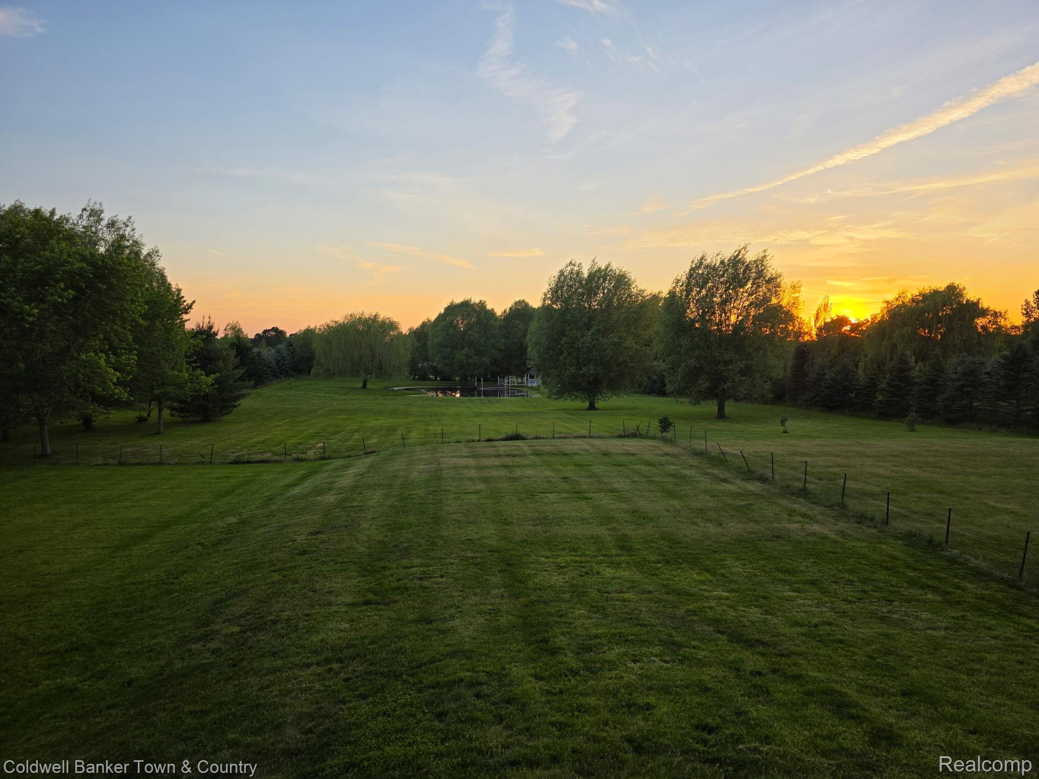717 North Youngs Road Attica, MI 48412 - Photo 84 of 87 Expansive green landscape featuring mature trees and a tranquil pond