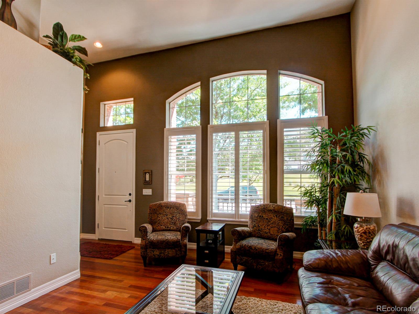 10186 RidgeGate Circle Lone Tree, CO 80124 - Photo 4 of 24 a living room with furniture and a window