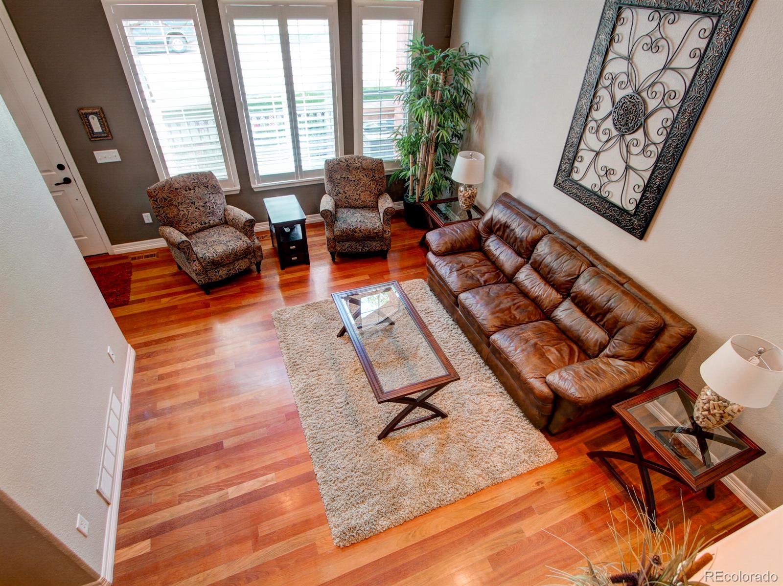 10186 RidgeGate Circle Lone Tree, CO 80124 - Photo 6 of 24 a living room with furniture and a large window