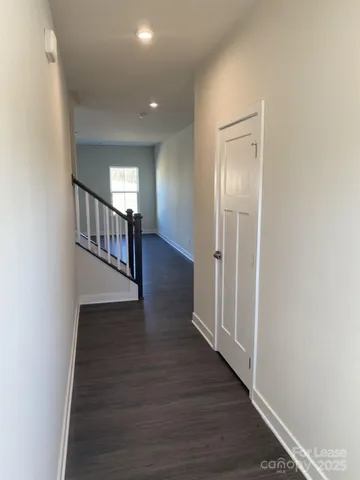 a view of entryway with wooden floor