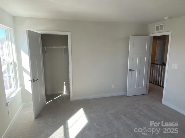a bathroom with a sink vanity mirror and toilet