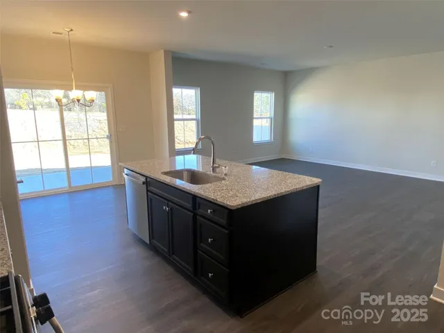 a bathroom with a sink a vanity and a large mirror