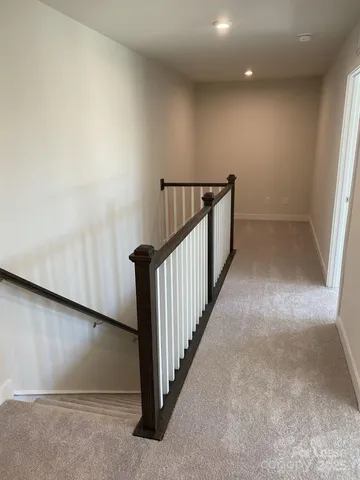 a view of a hallway with staircase