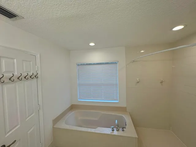 a bathroom with a double vanity sink and mirror