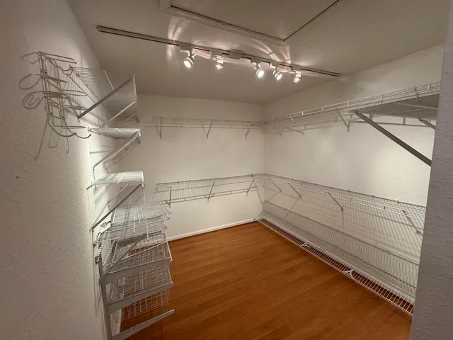 a view of a room with racks on the wall