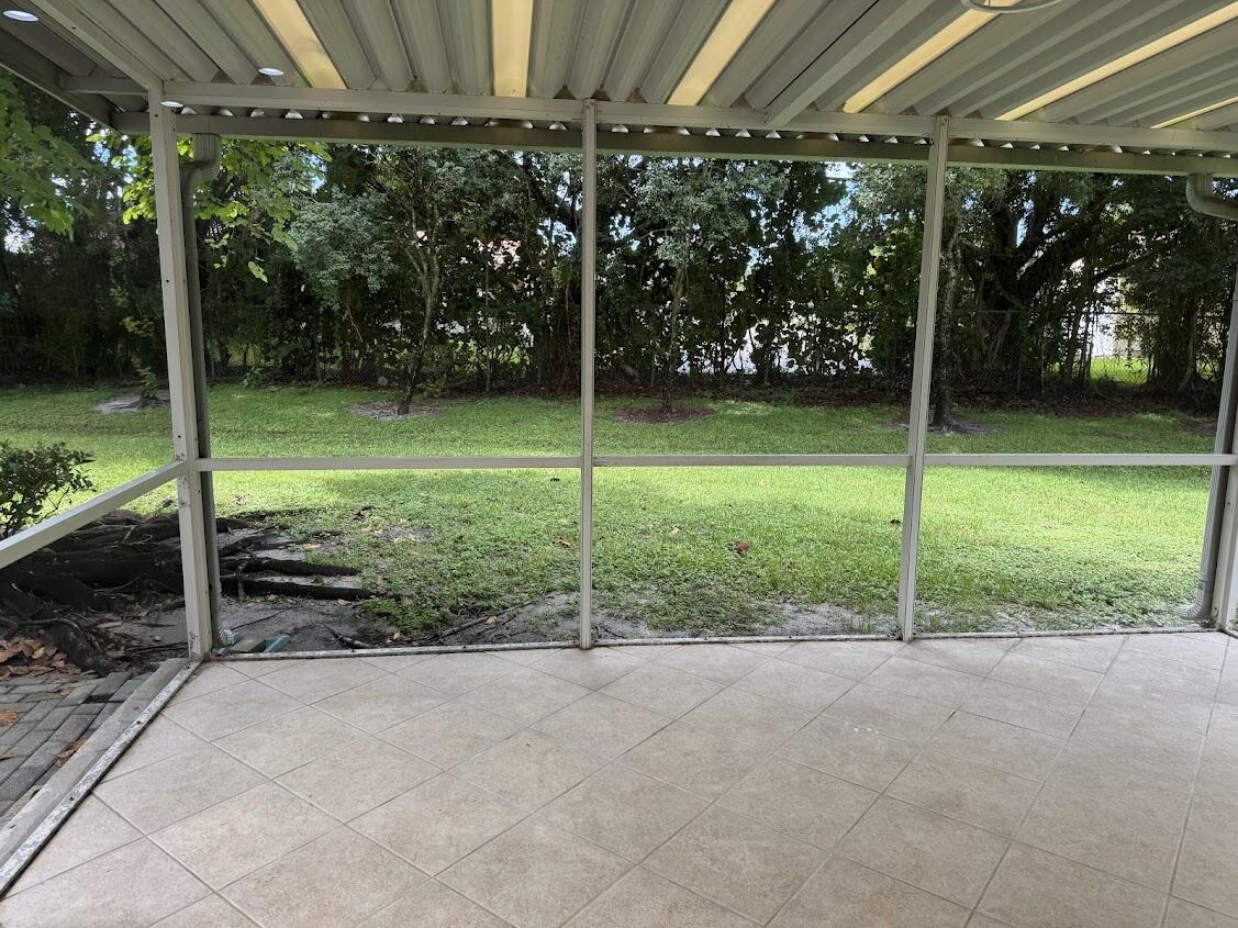 18237 Boca Way Drive Boca Raton, FL 33498 - Photo 30 of 36 a view of a house with backyard and porch