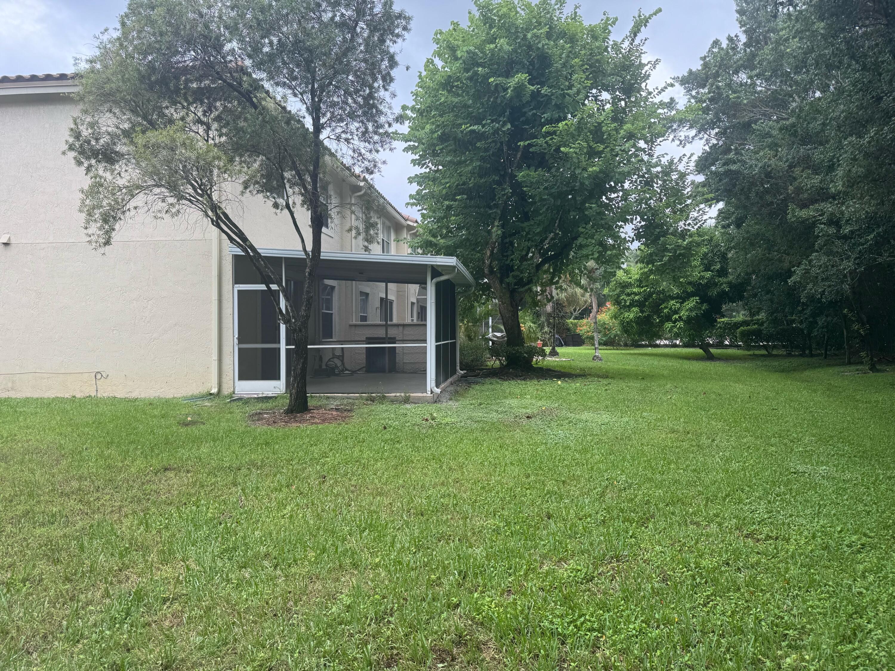 18237 Boca Way Drive Boca Raton, FL 33498 - Photo 35 of 36 a view of a house with backyard