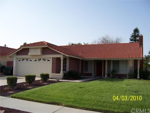 1463 Ripchak Road Corona, CA 92879 - Photo 1 of 1 a front view of a house with a garden and yard