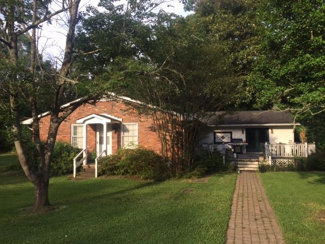 7798 Zebulon Road, Unit 1A Macon, GA 31220 - Photo 5 of 14 a front view of a house with garden