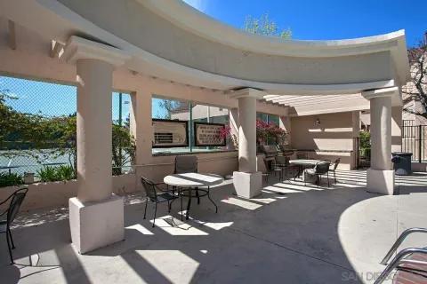 a outdoor space with chairs and a potted plant