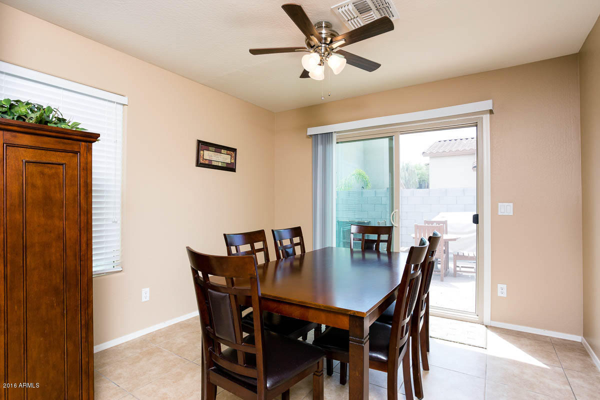 2676 South De Soto Road Apache Junction, AZ 85119 - Photo 6 of 19 a view of a dining room with furniture and a window