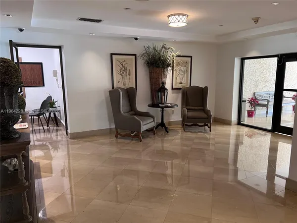 a view of a livingroom with furniture and a flat screen tv