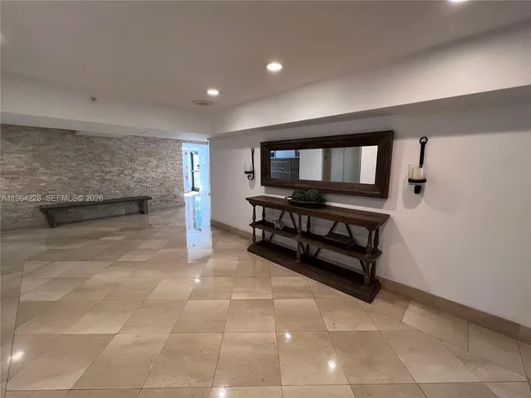 a view of workspace with furniture and window