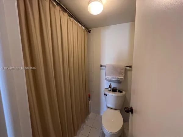 a bathroom with a toilet and a sink