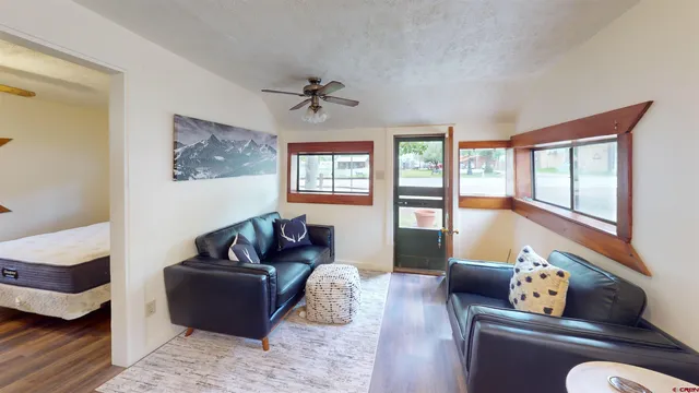 a living room with furniture and a window