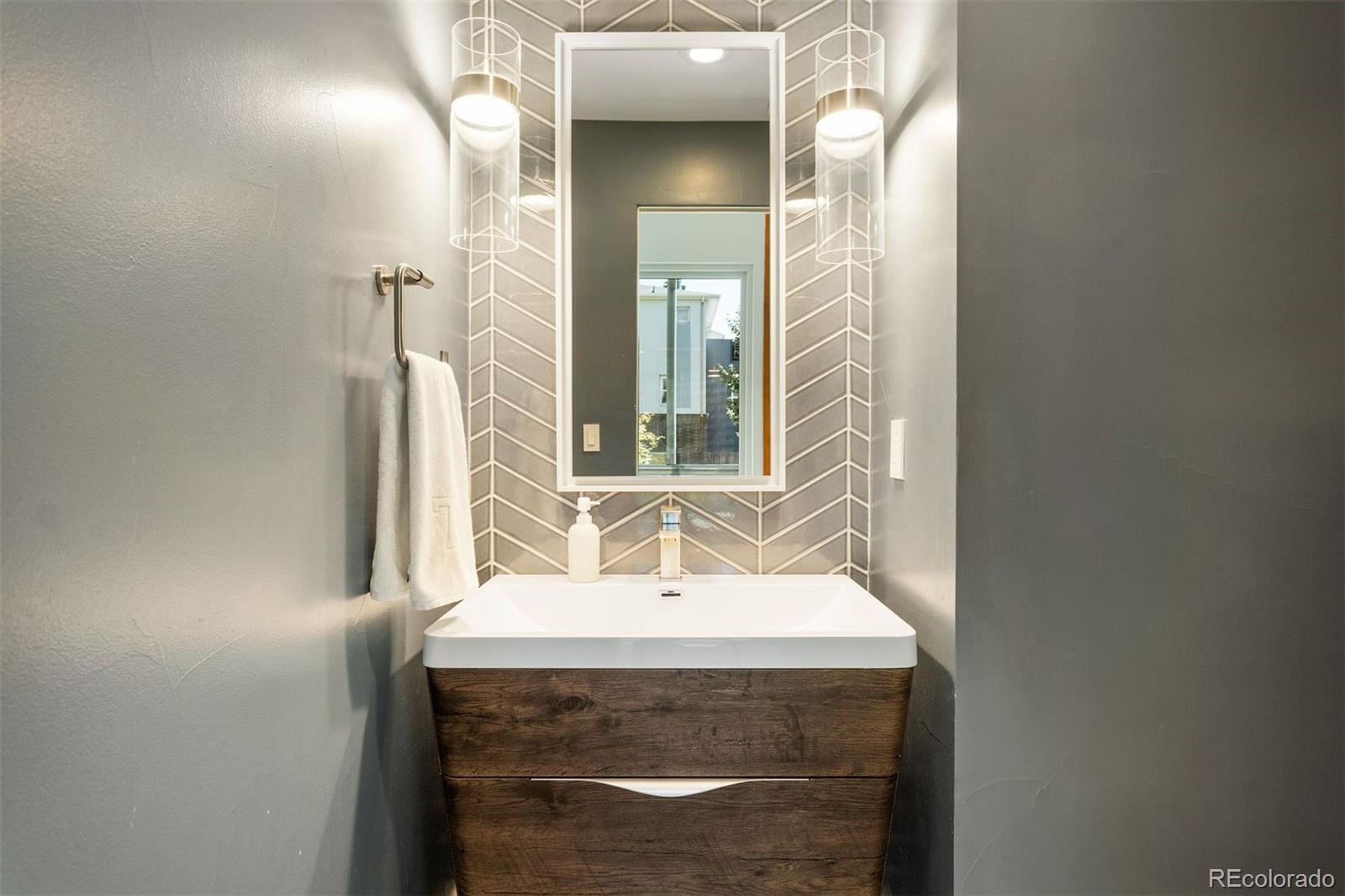 3400 Tejon Street Denver, CO 80211 - Photo 18 of 43 a bathroom with a sink and a mirror