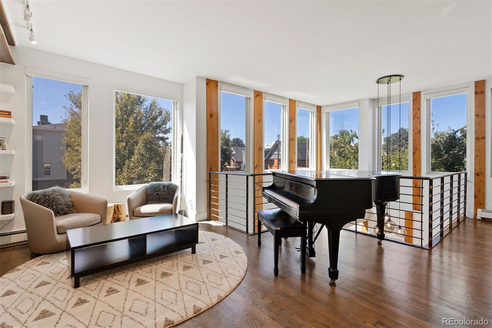 3400 Tejon Street Denver, CO 80211 - Photo 20 of 43 a living room with furniture and a floor to ceiling window