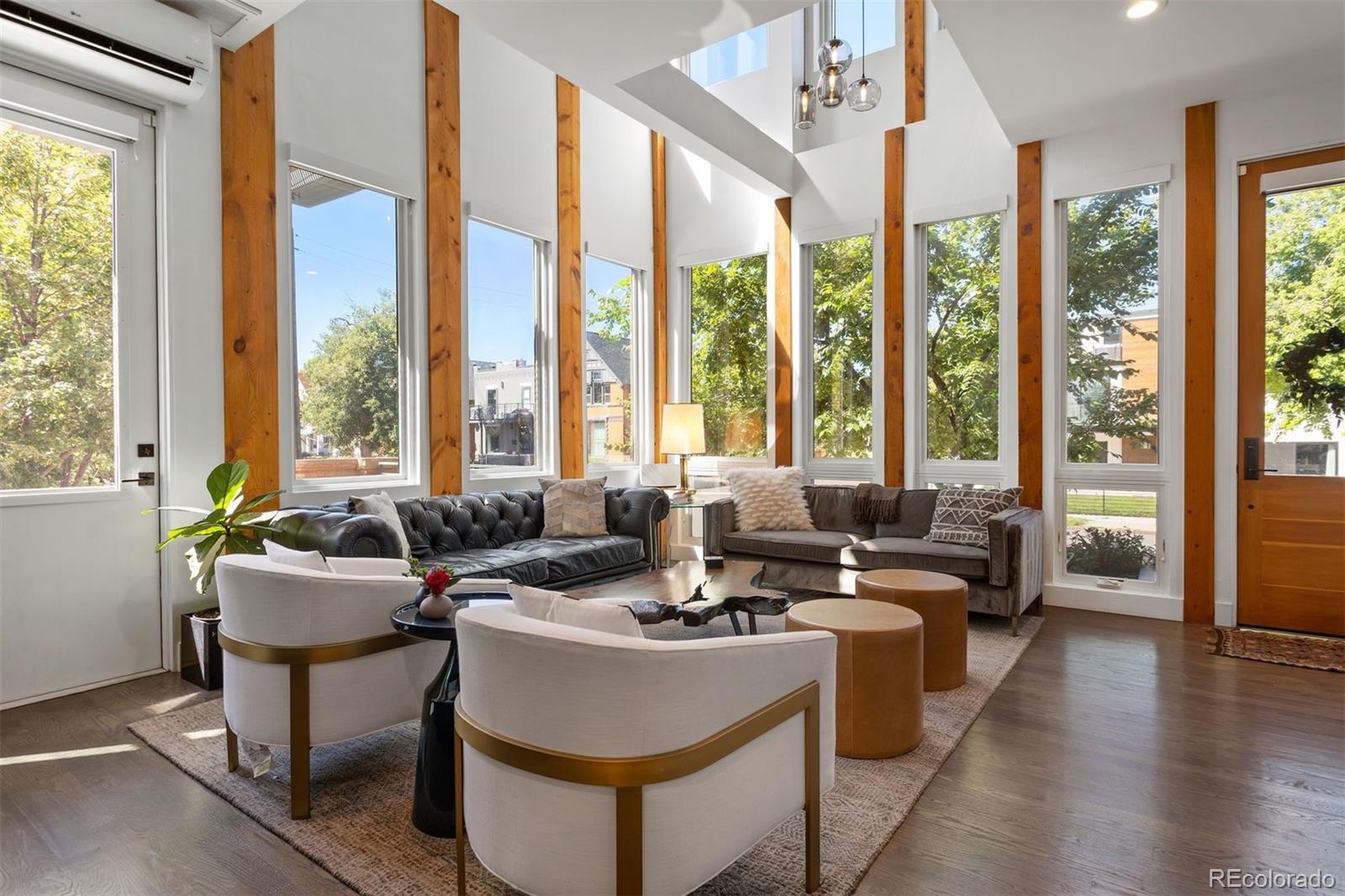 3400 Tejon Street Denver, CO 80211 - Photo 2 of 43 a living room with furniture and large windows