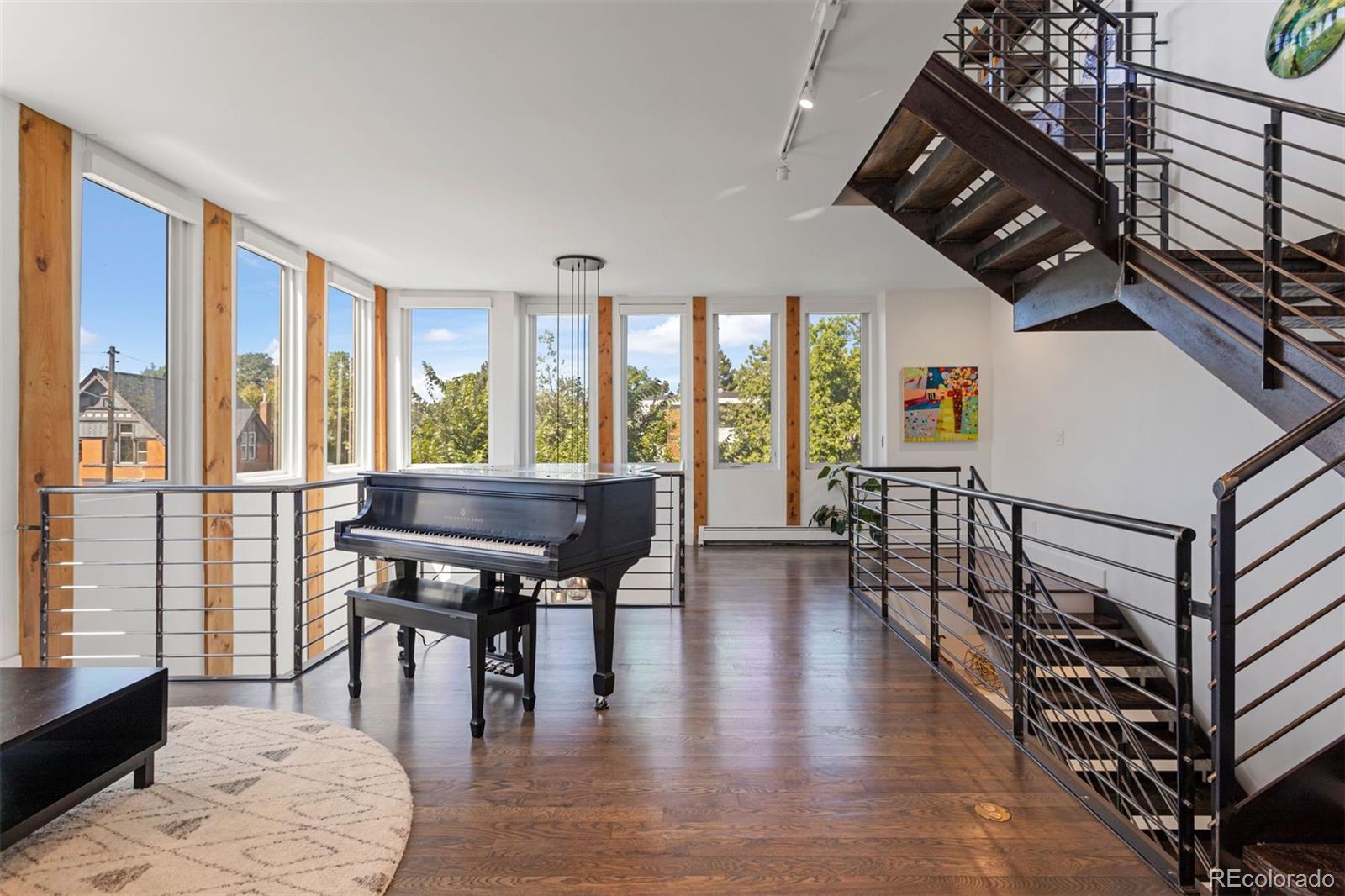 3400 Tejon Street Denver, CO 80211 - Photo 21 of 43 a living room with furniture a wooden floor and next to a window