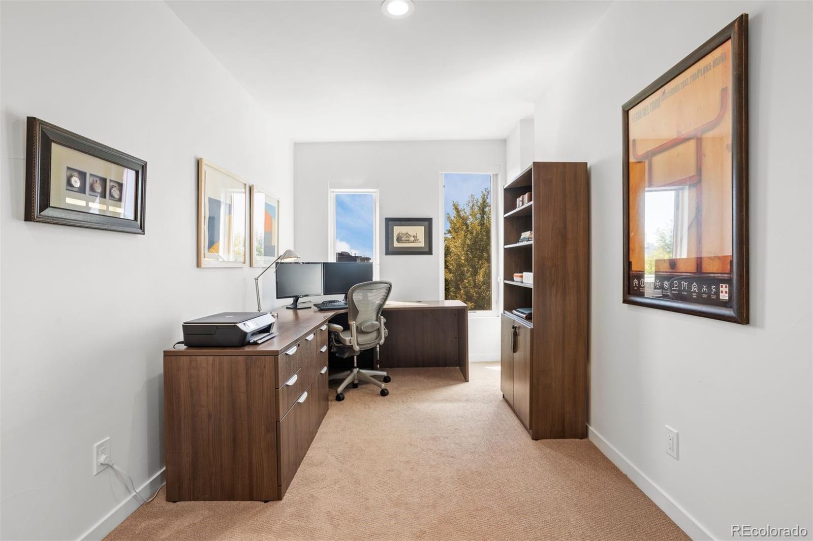 3400 Tejon Street Denver, CO 80211 - Photo 31 of 43 a living room with furniture and a flat screen tv