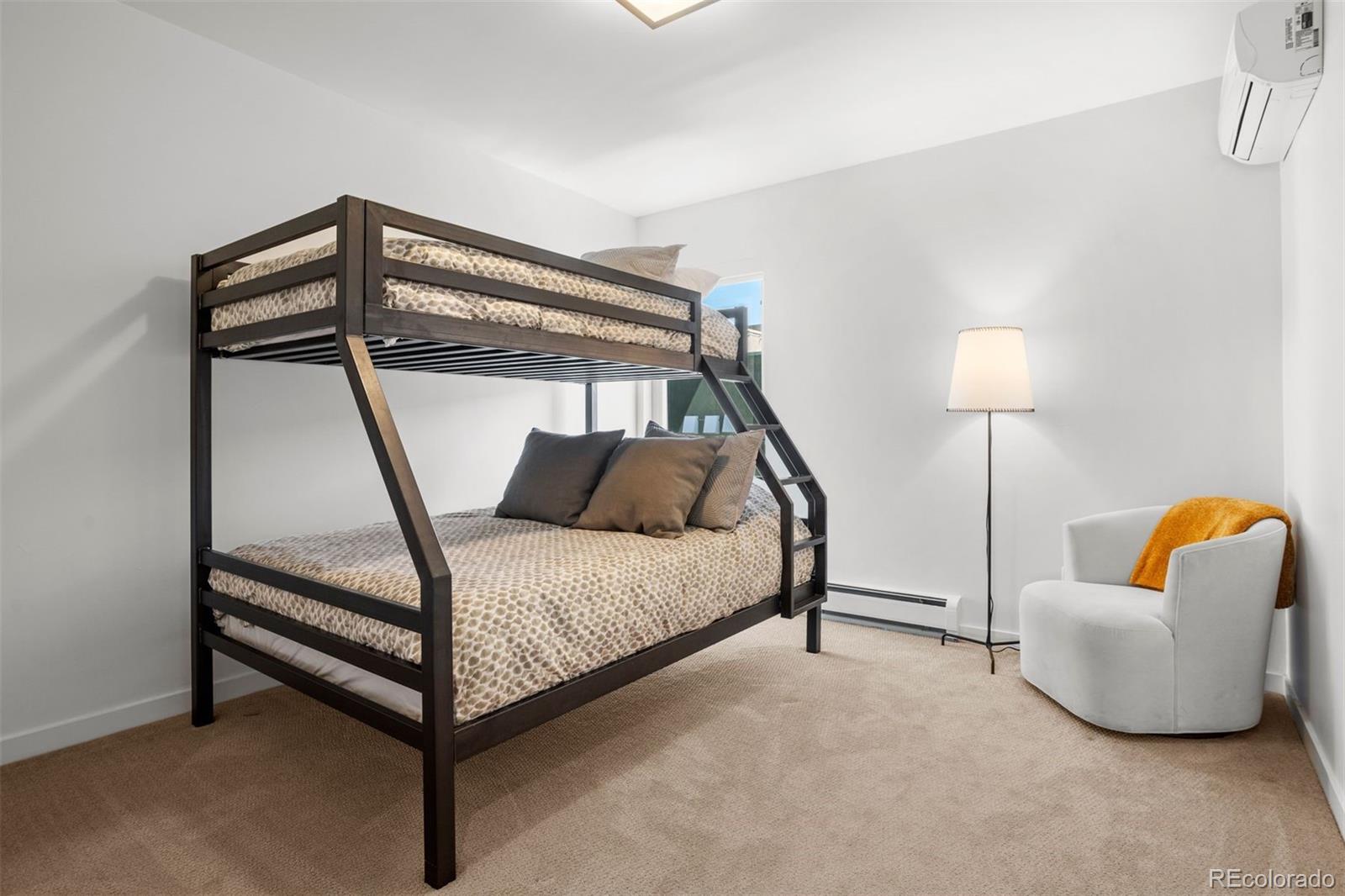 3400 Tejon Street Denver, CO 80211 - Photo 34 of 43 a bedroom with a bed and a lamp