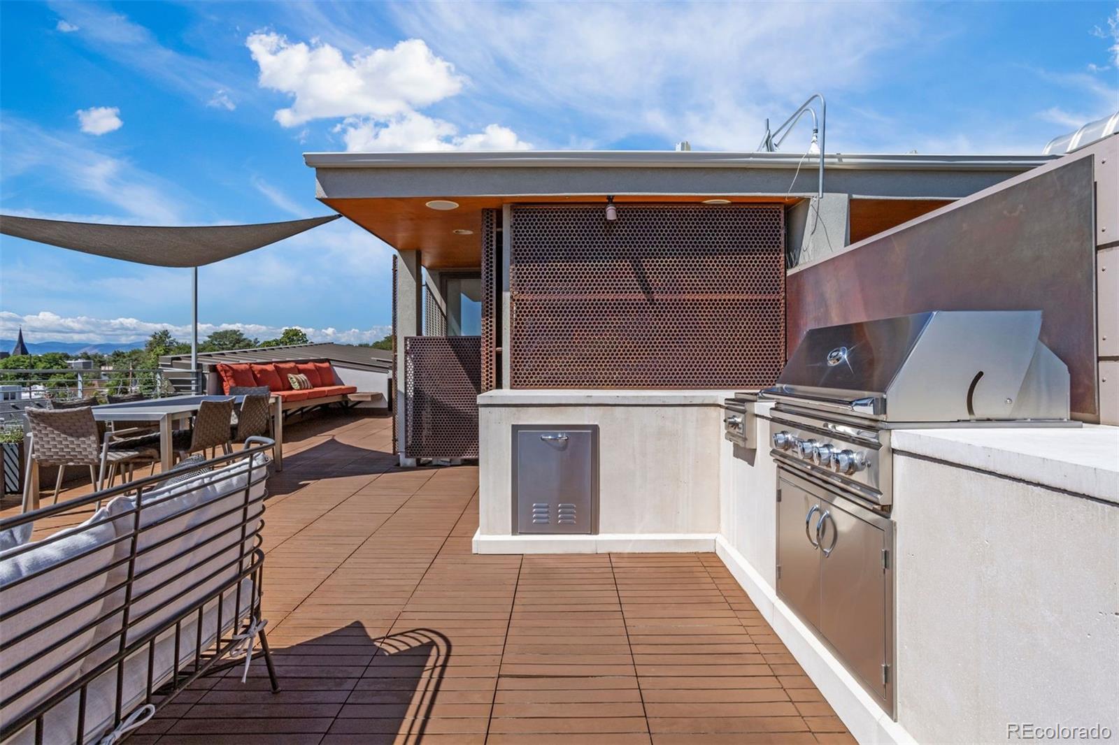 3400 Tejon Street Denver, CO 80211 - Photo 40 of 43 a kitchen with stainless steel appliances granite countertop a stove a sink and a refrigerator