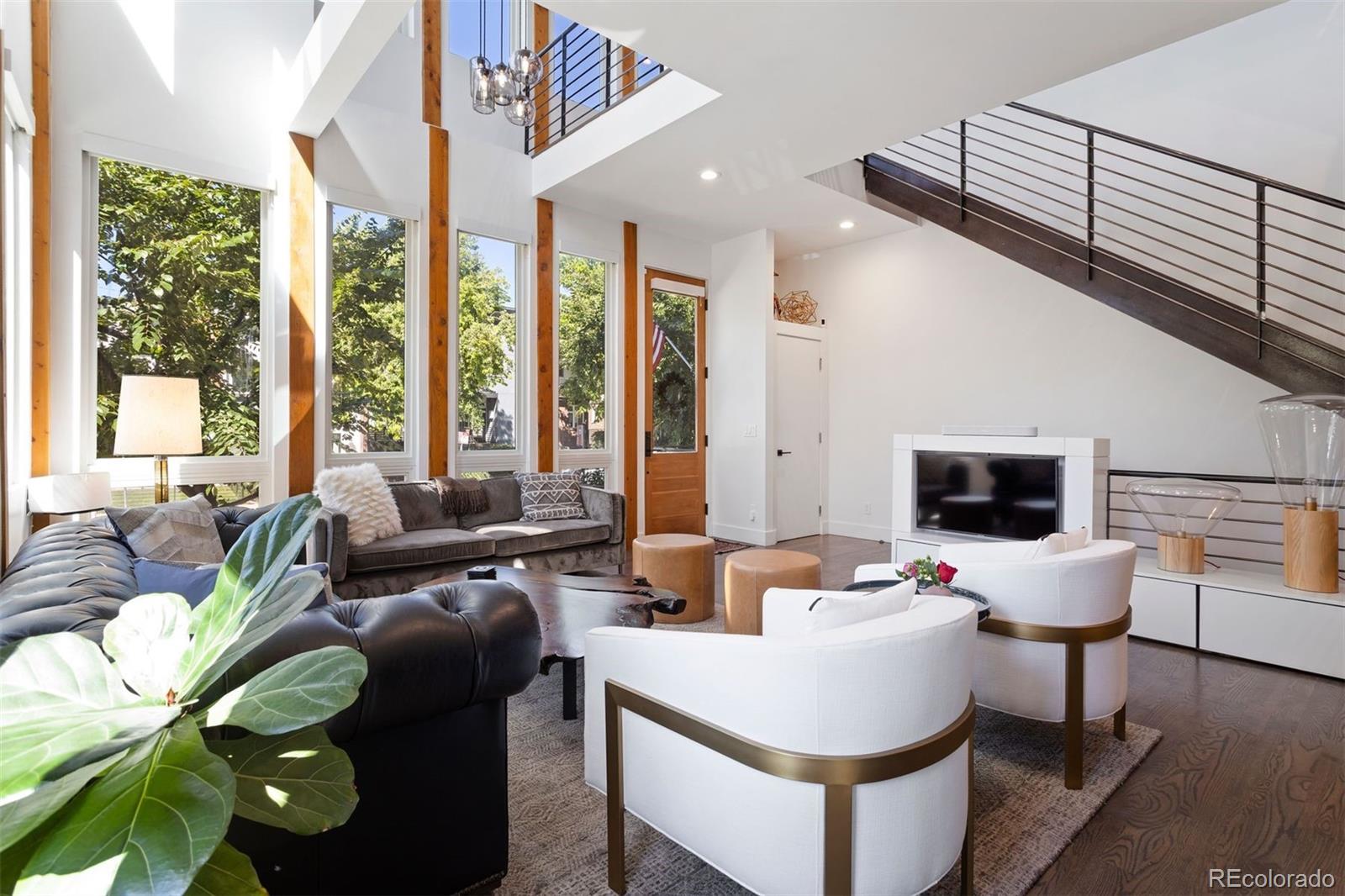 3400 Tejon Street Denver, CO 80211 - Photo 5 of 43 a living room with furniture and a flat screen tv